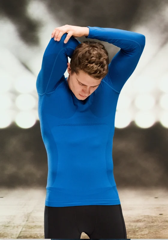 Man stretching in blue athletic shirt